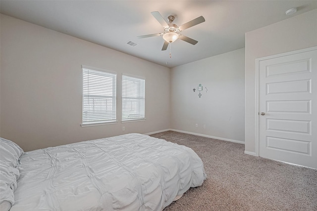 bedroom with ceiling fan and carpet