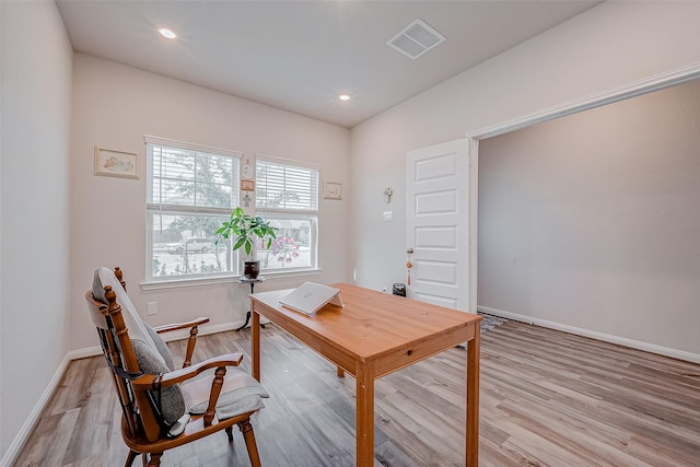 office area with light hardwood / wood-style floors