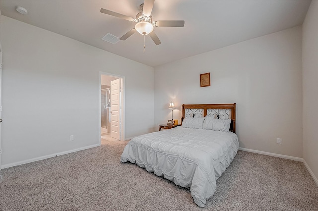 carpeted bedroom with ceiling fan and ensuite bathroom