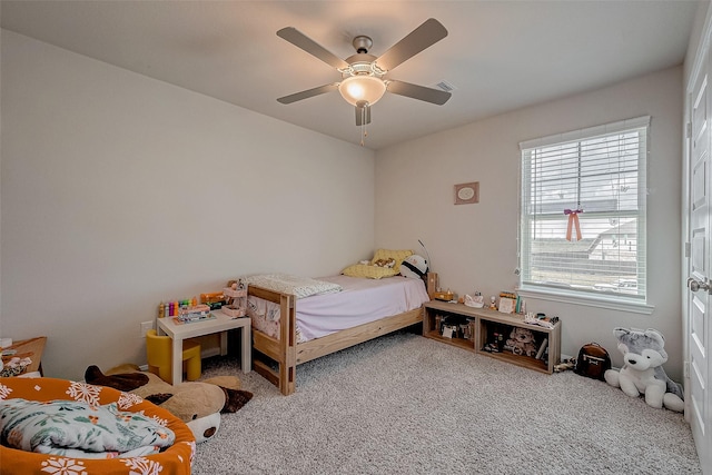 bedroom with ceiling fan and carpet flooring