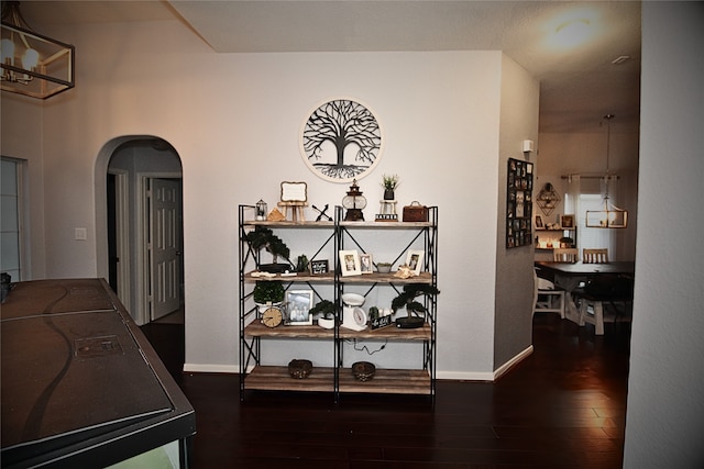 hall with dark hardwood / wood-style flooring