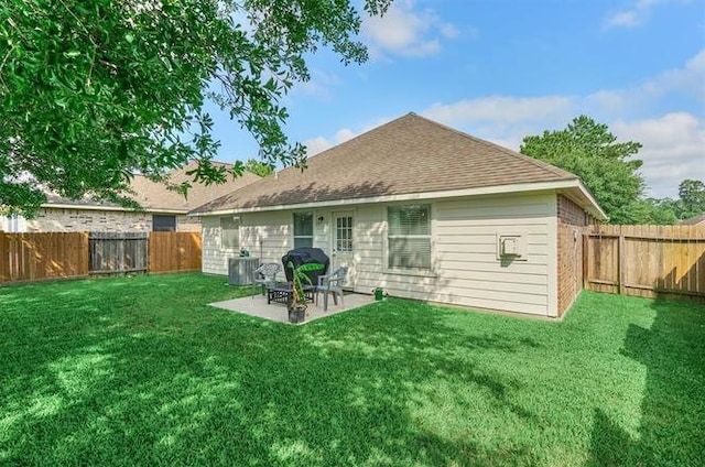 back of property featuring cooling unit, a lawn, and a patio area