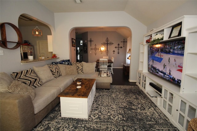 living room featuring vaulted ceiling