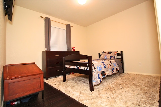 bedroom with hardwood / wood-style floors