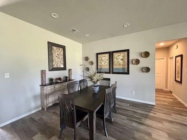 dining space featuring dark wood-type flooring