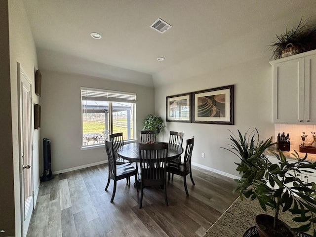 dining space with dark wood-type flooring