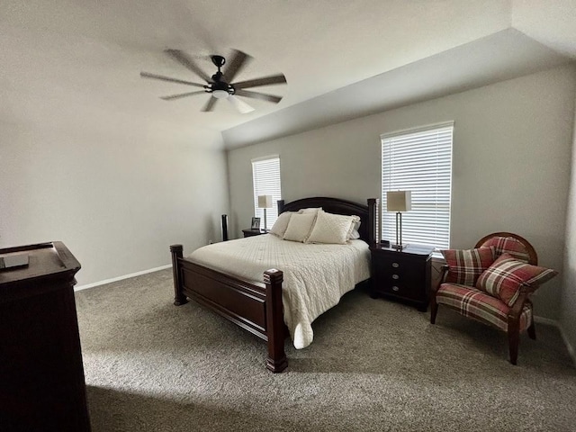 carpeted bedroom featuring multiple windows, lofted ceiling, and ceiling fan