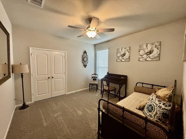 carpeted bedroom with a closet and ceiling fan