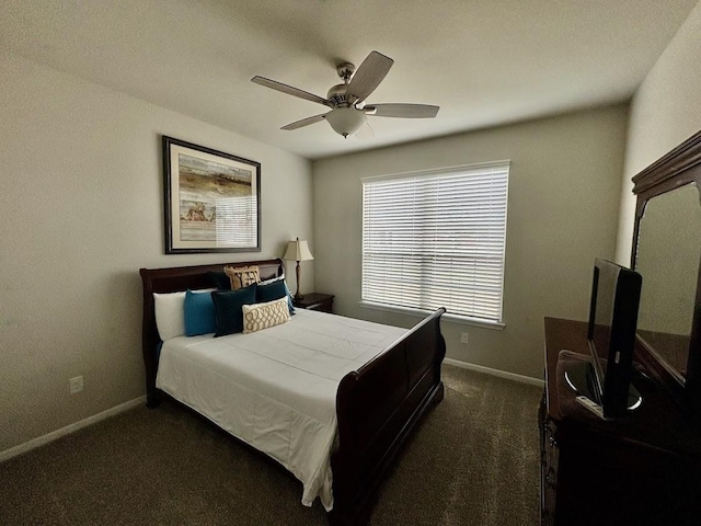 bedroom featuring ceiling fan and dark carpet