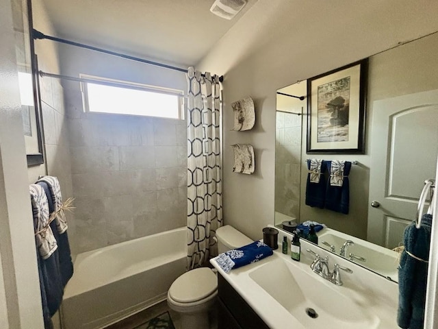 full bathroom featuring shower / bath combination with curtain, vanity, and toilet