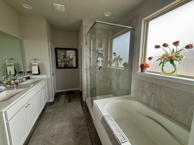 bathroom with vanity and plus walk in shower