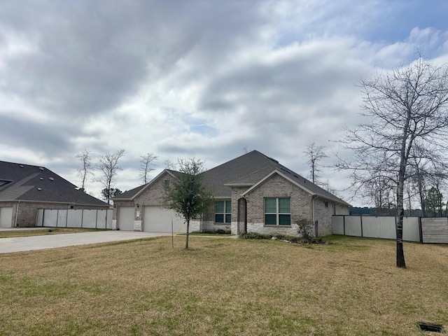 ranch-style home featuring a garage and a front lawn