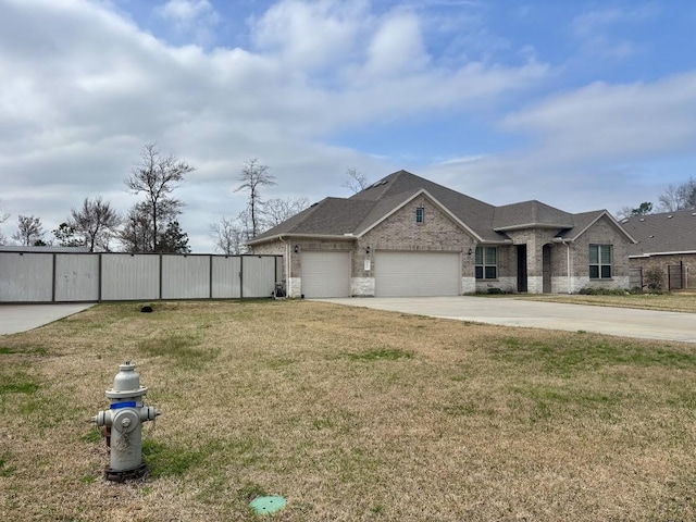 view of front facade featuring a garage and a front lawn