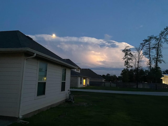 view of yard at dusk