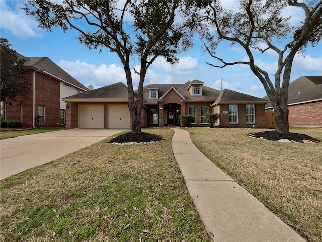 view of front of property with a garage and a front yard