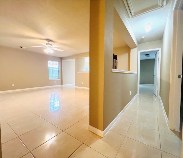 corridor featuring light tile patterned floors