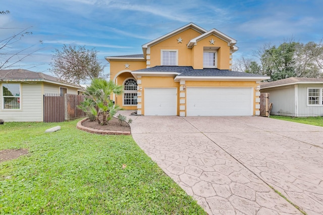 view of front property featuring a garage and a front lawn