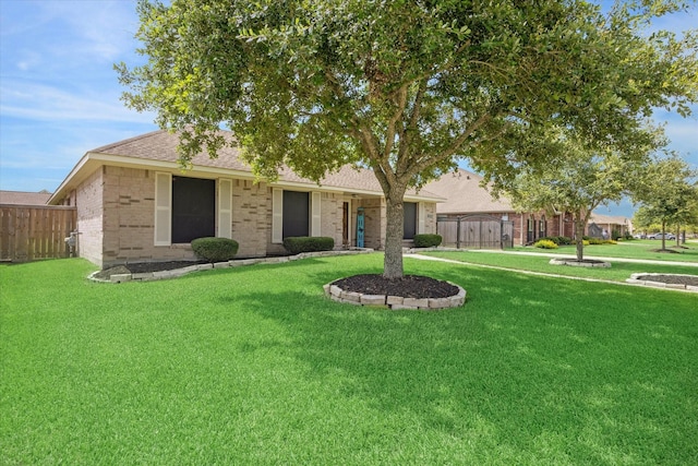 single story home featuring a front yard