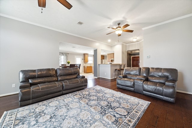 living room featuring ornamental molding, dark hardwood / wood-style floors, and ceiling fan