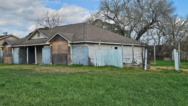 garage featuring a lawn