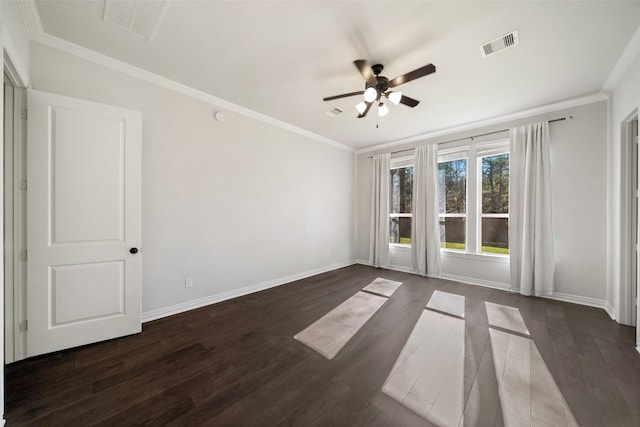 empty room featuring dark hardwood / wood-style flooring, crown molding, and ceiling fan