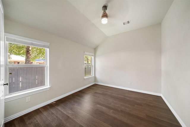 unfurnished room with dark hardwood / wood-style flooring, vaulted ceiling, and ceiling fan