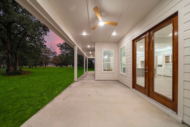 view of patio / terrace with a ceiling fan and french doors