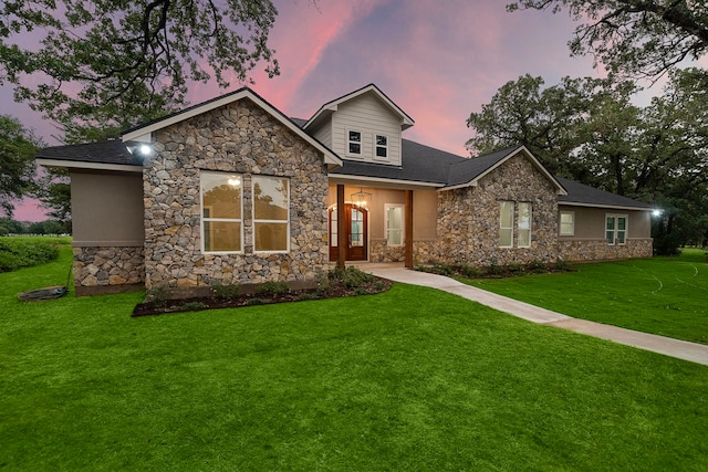 view of front of home featuring a front lawn and stucco siding