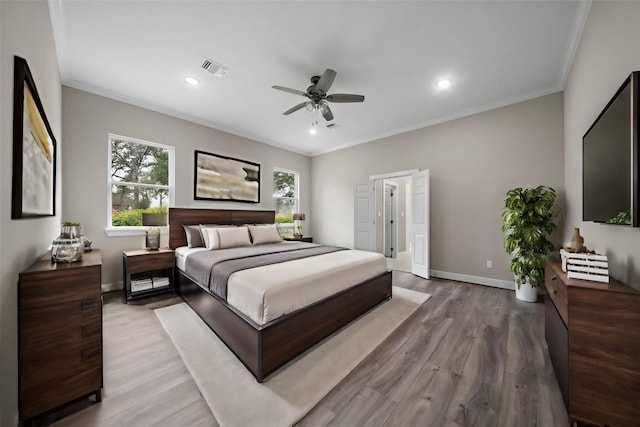 bedroom featuring visible vents, baseboards, crown molding, light wood-style floors, and recessed lighting