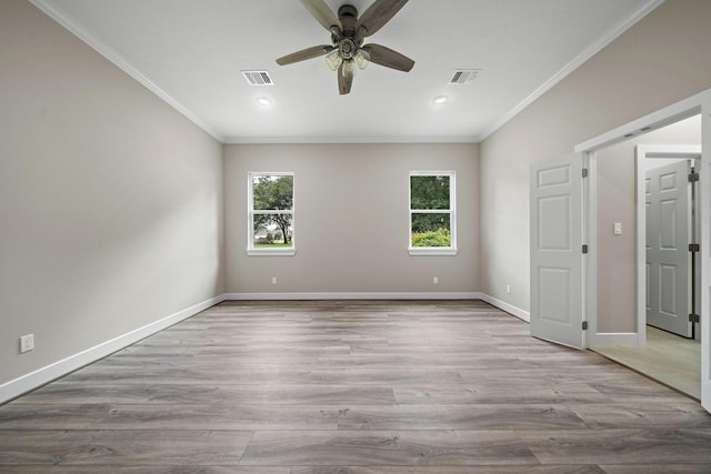 unfurnished bedroom featuring visible vents, crown molding, and baseboards