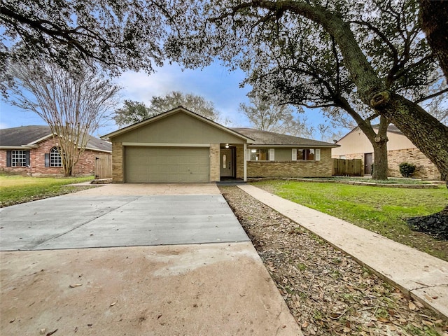 ranch-style home featuring a garage and a front yard