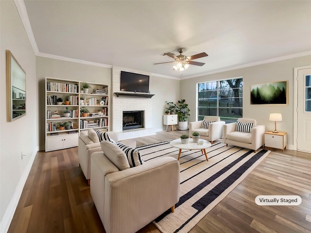 living room with ornamental molding and hardwood / wood-style floors