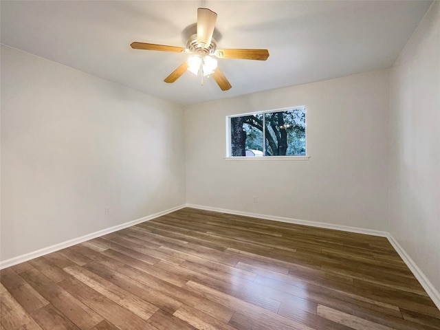 spare room featuring hardwood / wood-style flooring and ceiling fan