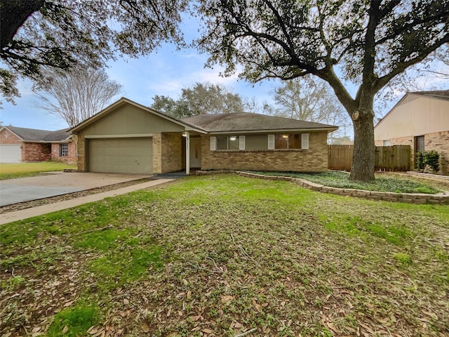 ranch-style home featuring a garage and a front lawn