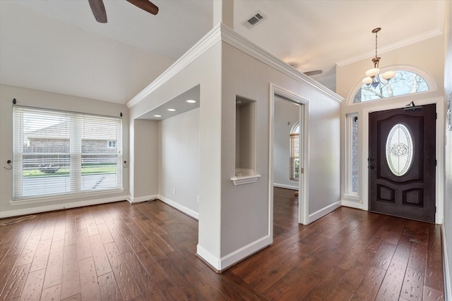 entryway with dark hardwood / wood-style flooring and crown molding