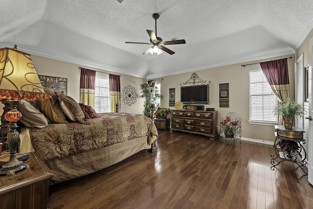 bedroom featuring multiple windows, dark hardwood / wood-style floors, and a textured ceiling