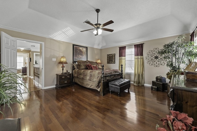 bedroom with dark hardwood / wood-style flooring, multiple windows, ornamental molding, and a textured ceiling