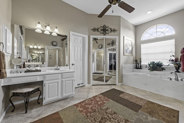 bathroom featuring vanity, a bath, tile patterned floors, and ceiling fan