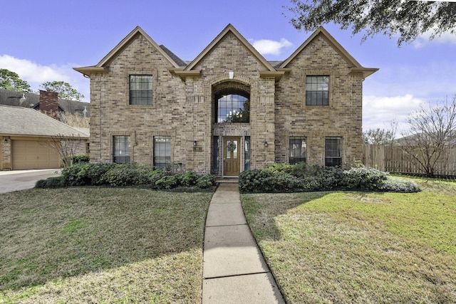 view of front facade featuring a garage and a front lawn