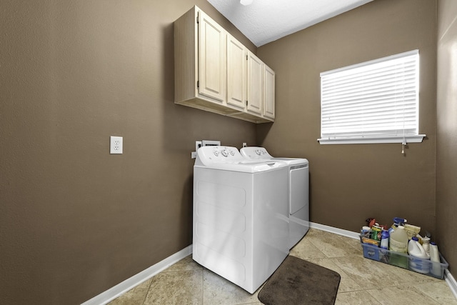 laundry area with cabinets and washing machine and dryer