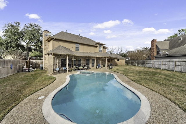 view of swimming pool featuring a lawn and a patio