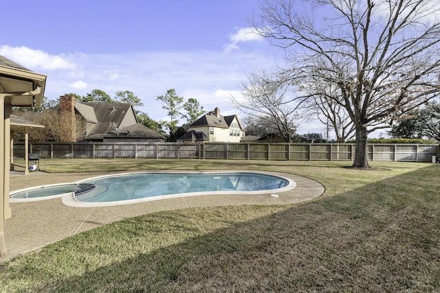 view of pool with a lawn