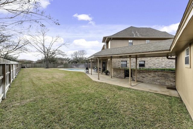 view of yard featuring a fenced in pool and a patio