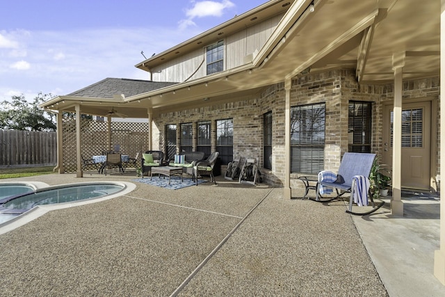 exterior space with ceiling fan and a patio area