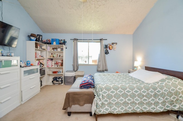 carpeted bedroom featuring lofted ceiling and a textured ceiling