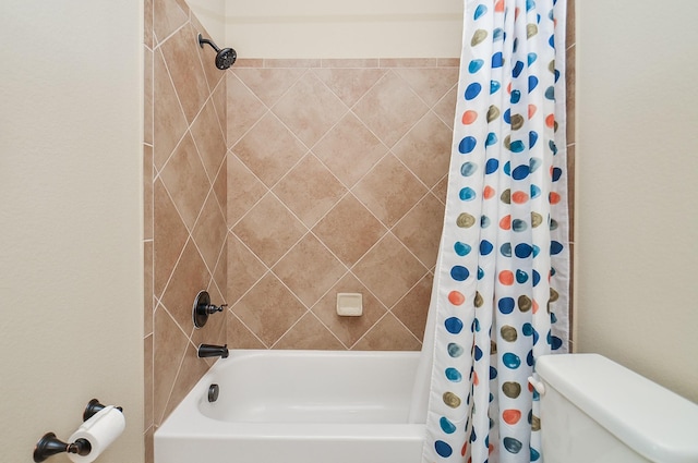 bathroom with toilet and shower / bath combo