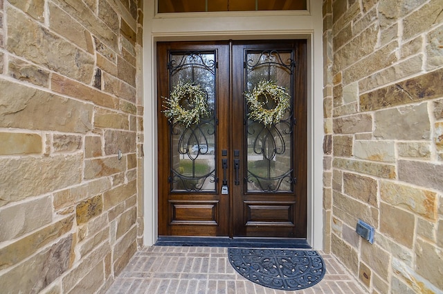 property entrance featuring french doors