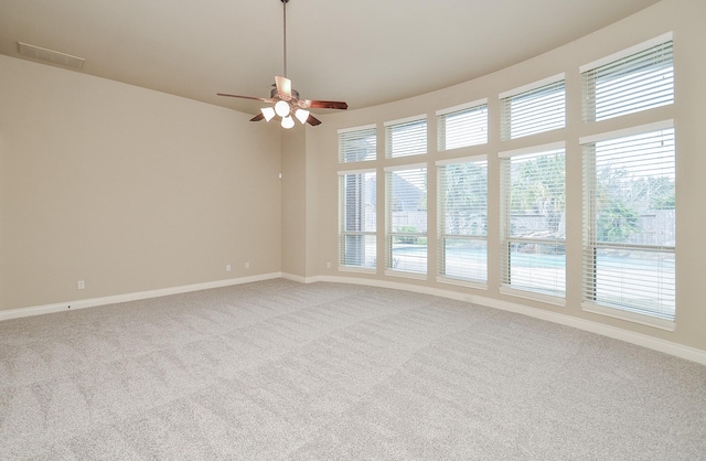 empty room with light colored carpet and ceiling fan