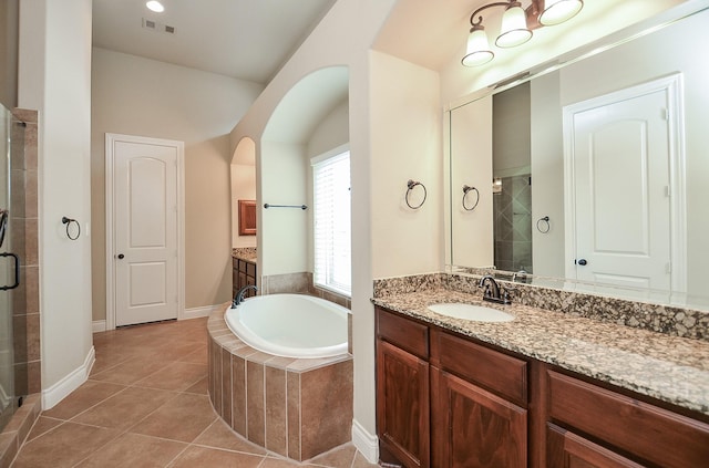 bathroom with vanity, shower with separate bathtub, and tile patterned flooring