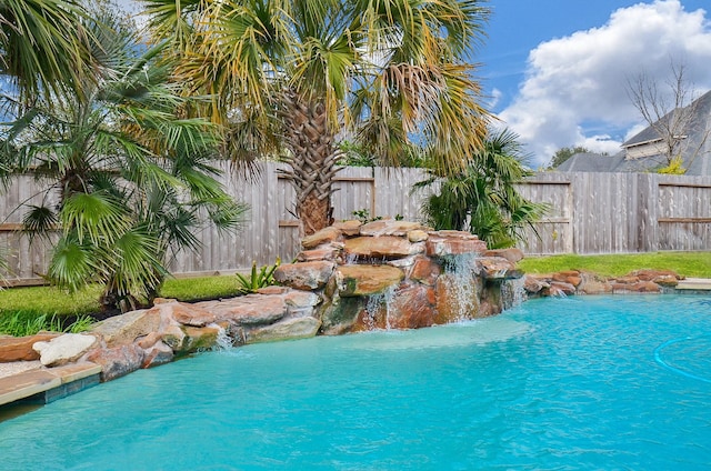 view of pool with pool water feature